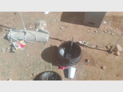 Taxi drivers prepare potjie meals in the parking lot of the church. Photo supplied.