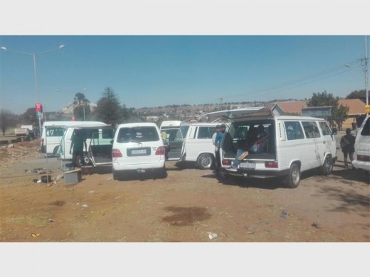 On a daily basis dozens of taxis park and squat in the parking lot of a church opposite a local high school. Photo supplied.