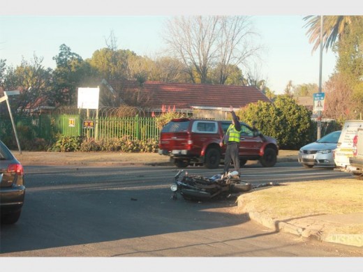 The wrecked motorcycle lying on the corner of Viljoen and First Streets.