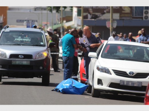 Rissik Street, Krugersdorp was a crime scene this afternoon after a man was fatally shot in his vehicle.