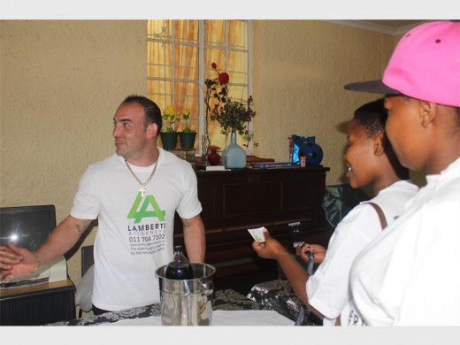 Marco Lamberti, owner of Lamberti Attorneys explaining to the pupils how dedication can make them rich.