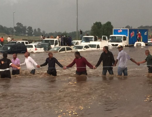 Motorists formed human ropes by holding hands to save people stuck in the flood water.  Photo: Supplied