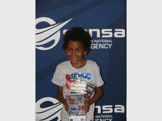 Vershano is very excited about all the gifts he got from the Reach for a Dream Foundation.