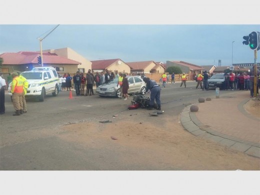 A member of the police at the motorcycle that was involved in the accident.