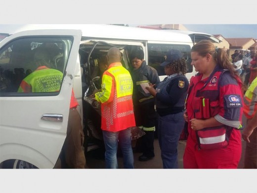 Police and paramedics at the taxi that was involved in the accident.
