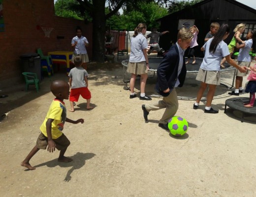 Let the games begin! A Maragon learner plays soccer with a child.