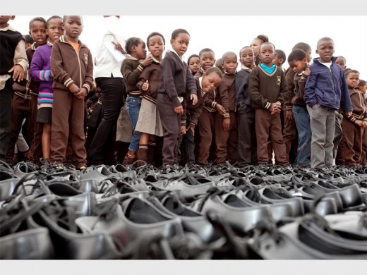 Excited Munsieville Primary School pupils waiting to receive their new school shoes.