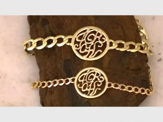 John Williams was robbed of his bracelet; the top one.