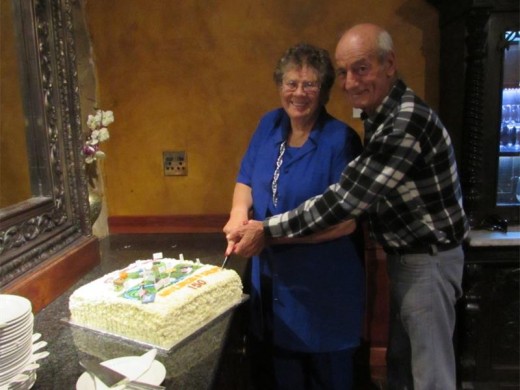 Lynette Mulder and Charles Koekemoer cutting Muldersdrift's 150th birthday cake.