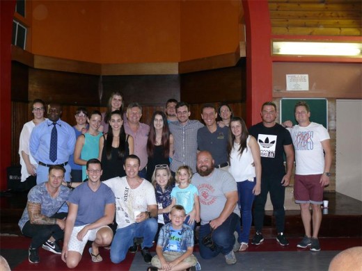 The Young Adults Group with the Project Manager of Ikusasa Community Development, Donald Nyinenda (second from left, standing).