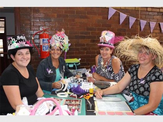 The winning table with their exquisite hats. Elanie Maree, Salomé van der Westhuizen, Wilna du Plessis and Betsie Brink.