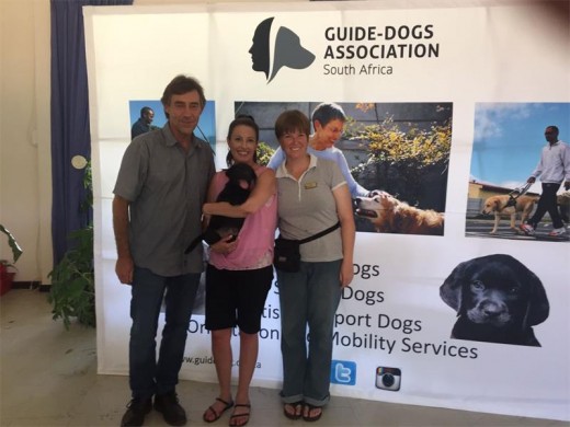 Local ward councillor Jacques Hoon collecting Logan, a guide dog puppy, from the GDA.