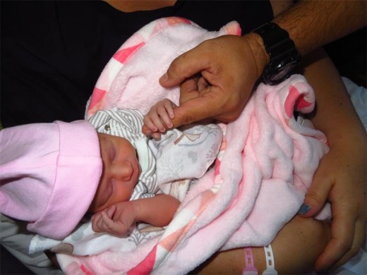 Abigail Verster was one of the town's first New Year's Day babies and was born at 8am in Netcare Krugersdorp Hospital. She weighed a mere 2,2kg and her entire hand is as big as half her father's index finger.