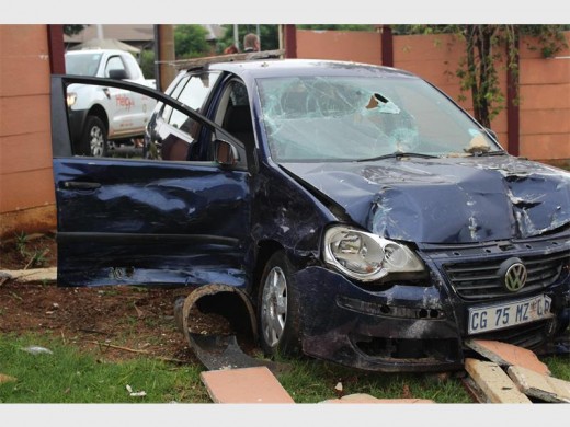 The car involved in the T-bone collision veered out, but drove through a residential wall.  Photo: Bianca Pindral