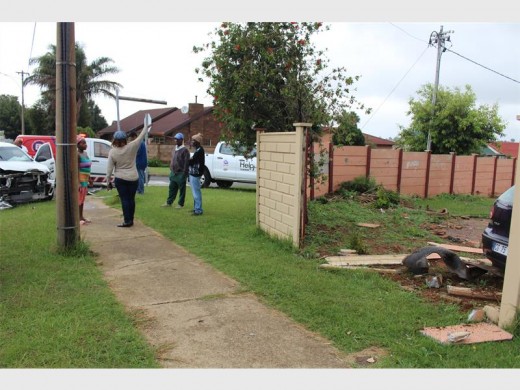 The scene where a bakkie and a car collided, causing the car to drive through a wall.  Photo: Bianca PIndral