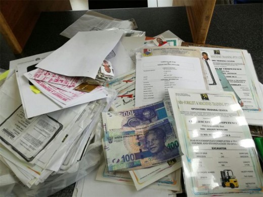 Police also discovered pictures, CVs and various documents describing people. It is believed the suspects used these documents to single out vulnerable victims. Photo: Krugersdorp Police