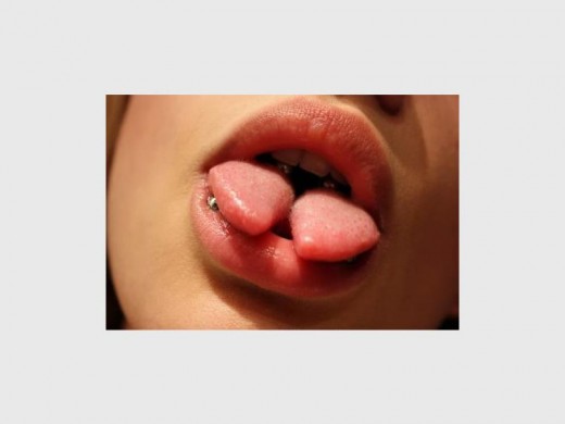Although some people might cringe at the idea of running a scalpel through their tongues, others consider it to be a 'cool' body modification. Photo: We Heart It