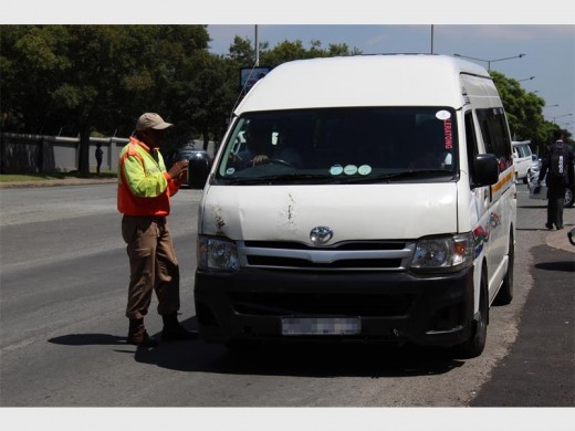 One of the officers stopped a taxi driver for not obeying the rules of the road.