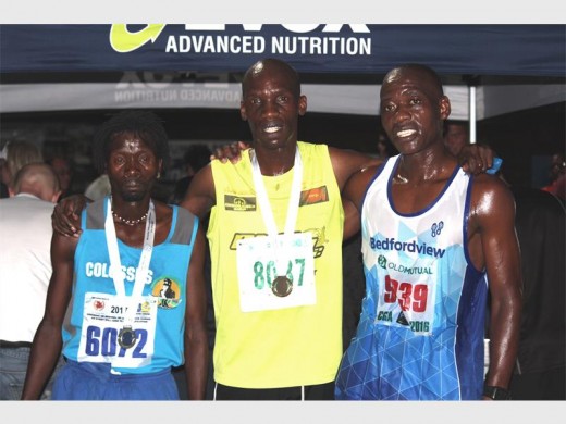 Libonto Tootse (2nd), Mbongeni Ngxazozo (1st), and Abram Khumalo (3rd) moments after they finished the McCarthy Roodepoort 15km night race.