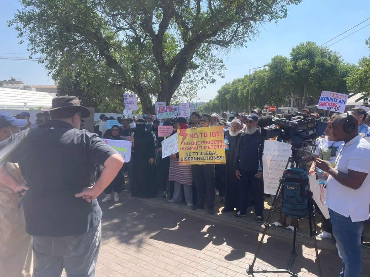 Azaadville residents, including those from informal settlements, gather at Town Hall to protest against unaffordable electricity tariffs.