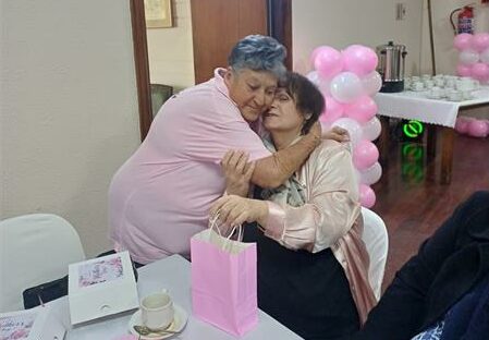 Volunteers served a three-course meal and hosted a heartfelt social gathering to celebrate and uplift elderly women at Memorial Flats.