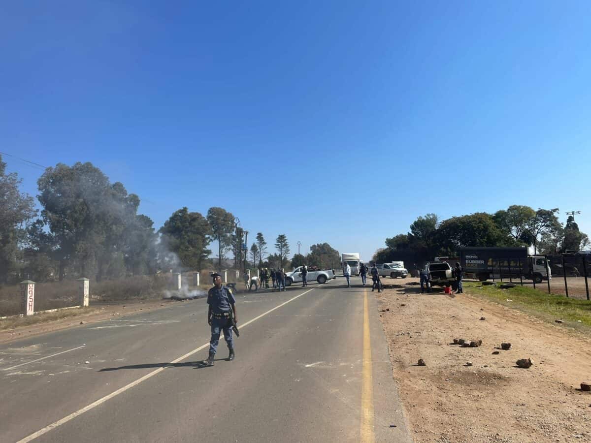 Police, private security and other emergency services are on the scene as protesters block the N14 in Muldersdrift.
