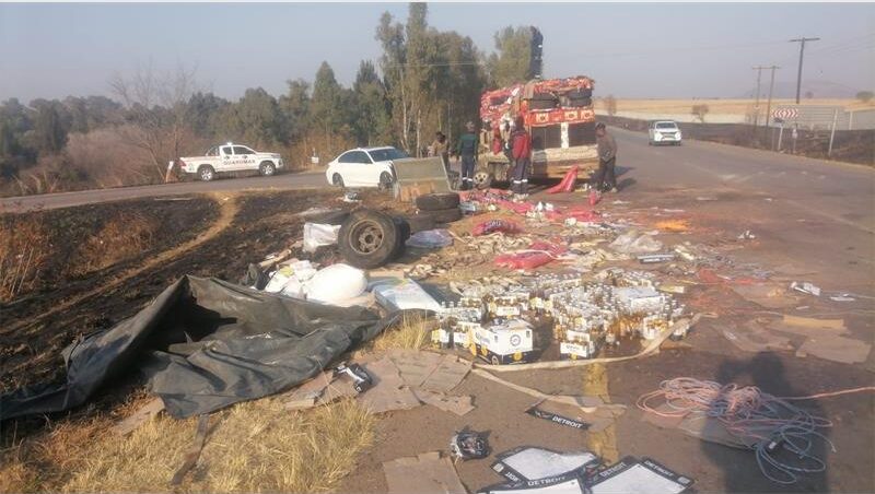 Emergency responders attended the scene after a truck allegedly jackknifed due to overloading and overturned, leaving the driver with only minor injuries.