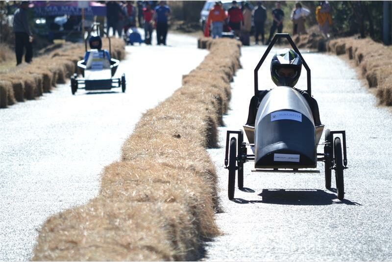 Teams from six schools designed, built and raced their own gravity-powered cars in a unique engineering competition hosted by Alma Mater International School.
