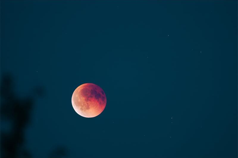 Local residents who wake early can catch the Earth's shadow covering the moon, with dark locations offering the best view.