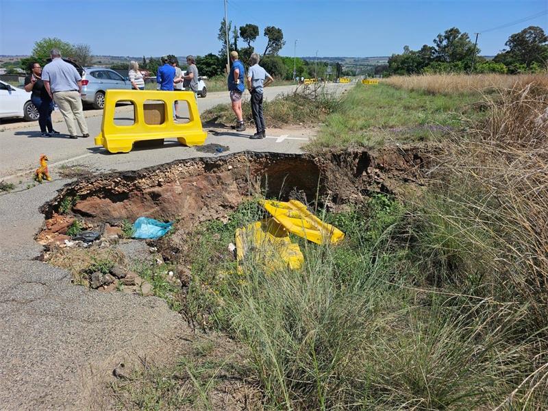 Community members express frustration as a dangerous sinkhole on a key route remains unresolved after nearly two years.