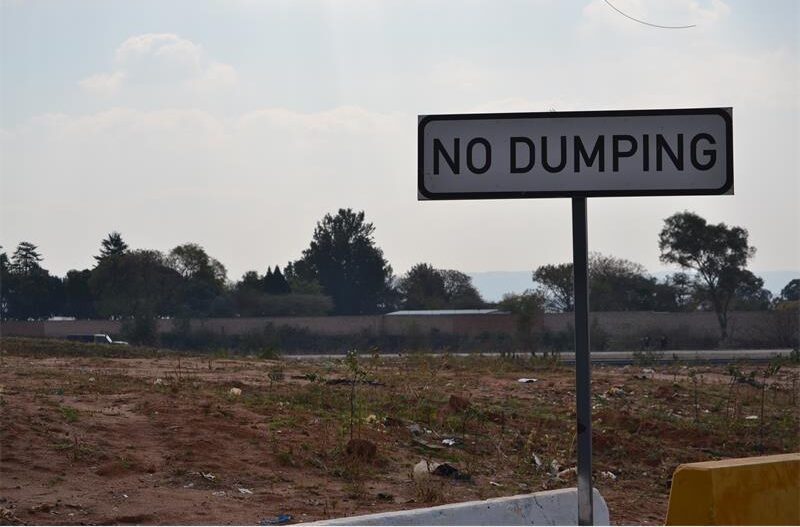 Although community action has led to the closure of a waste site near an informal settlement, a councillor warns tourist routes still remain affected by illegal dumping.