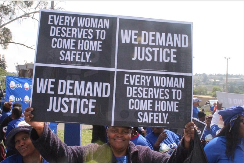 An acting station commander acknowledges gender-based violence is an epidemic as community members demand transparency and action.