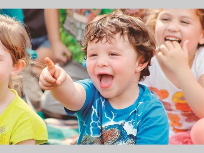 A toddler from Tjokkers Nursery School having a laugh during the Mr ADT Children's Security Educational Show.