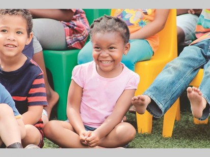 A toddler from Tjokkers Nursery School having a laugh during the Mr ADT Children's Security Educational Show.