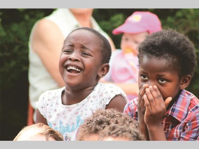 A toddler from Tjokkers Nursery School having a laugh during the Mr ADT Children's Security Educational Show.