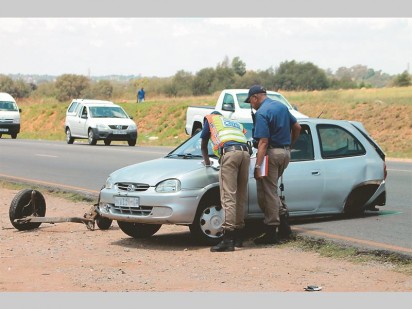 JMPD members at one of the damaged vehicles.