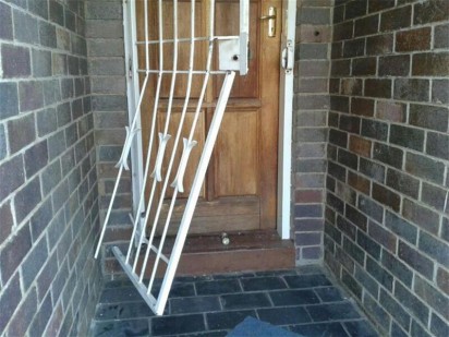 The security gate the burglars had broken down. They were caught before they could complete their criminal activities.