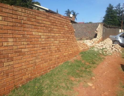 A pedesrian was hit before the vehicle ploughed through the wall.