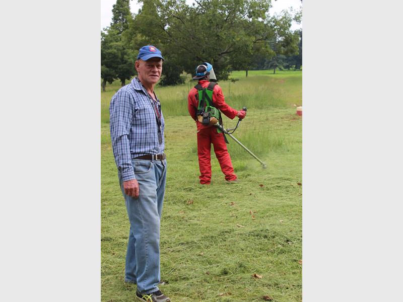 George Taylor overseeing the grass cutting at Len Rutter Park.