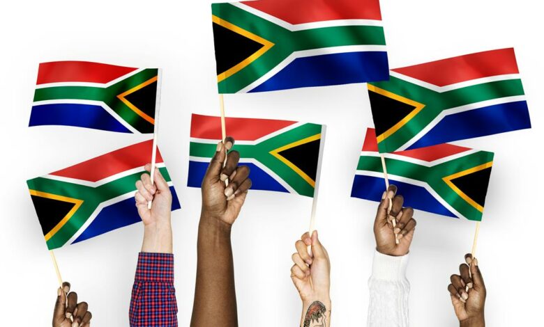 hands-waving-flags-south-africa (Medium)