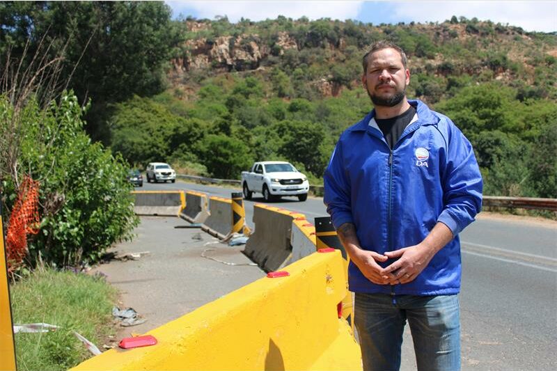 Barriers initially installed to protect motorists from a suspected sinkhole now symbolise ongoing government inaction and infrastructure decay.