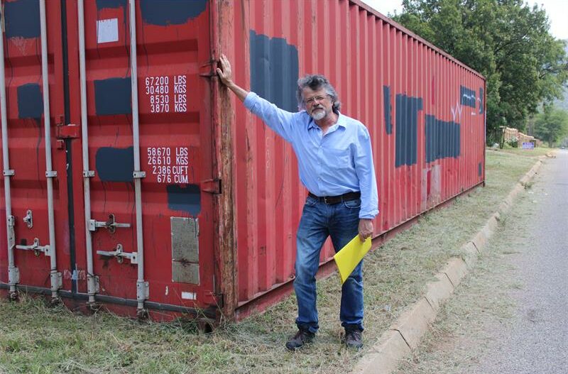 Despite repeated complaints and an on-site inspection, two large shipping containers remain 