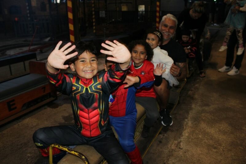 Families enjoy eerie train rides at Woodside Station on Halloween evening, hosted by the Rand Society of Model Engineers.