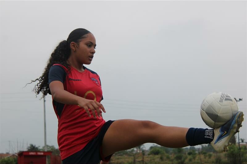 Young football star Athena is destined to triumph in women's football.