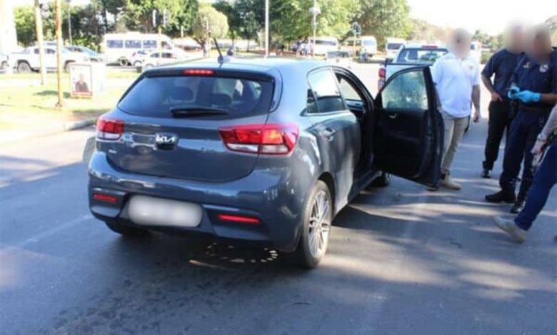 Authorities hunt quartet in hatchback after woman gunned down; enquiries continue amid speculation of deliberate attack.