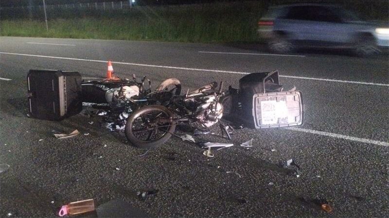 Two delivery motorcyclists collided after one rider rode in the oncoming traffic lane.