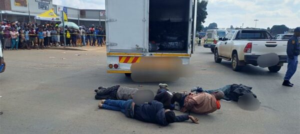Eight suspects accused of orchestrating a business robbery made their first court appearance and the case was postponed. All suspects were remanded in custody pending bail information.