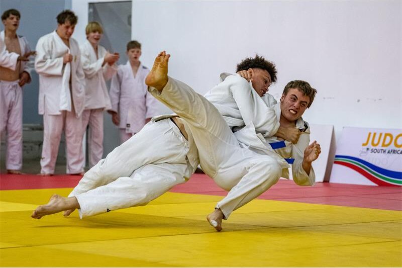 Kano Institute of Judo's Evan Rheinicke earns a silver medal at the SA Open Championships, followed by a brown belt.