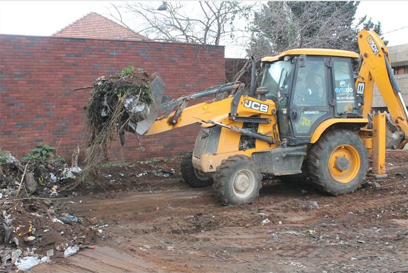 Community members, police and Crum joined forces to demolish the building and clear the grounds of overgrowth.