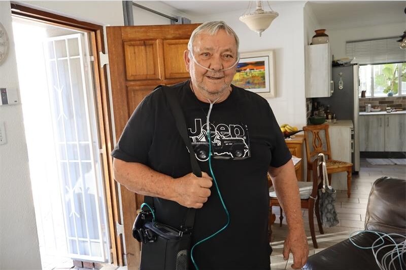 A 70-year-old resident relies on expensive generator fuel and backup cylinders to keep breathing during extended power disruptions.